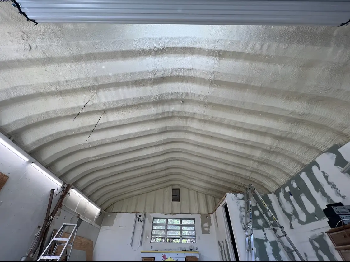 Spray polyurethane foam applied to the underside of a metal roof deck in Henryetta